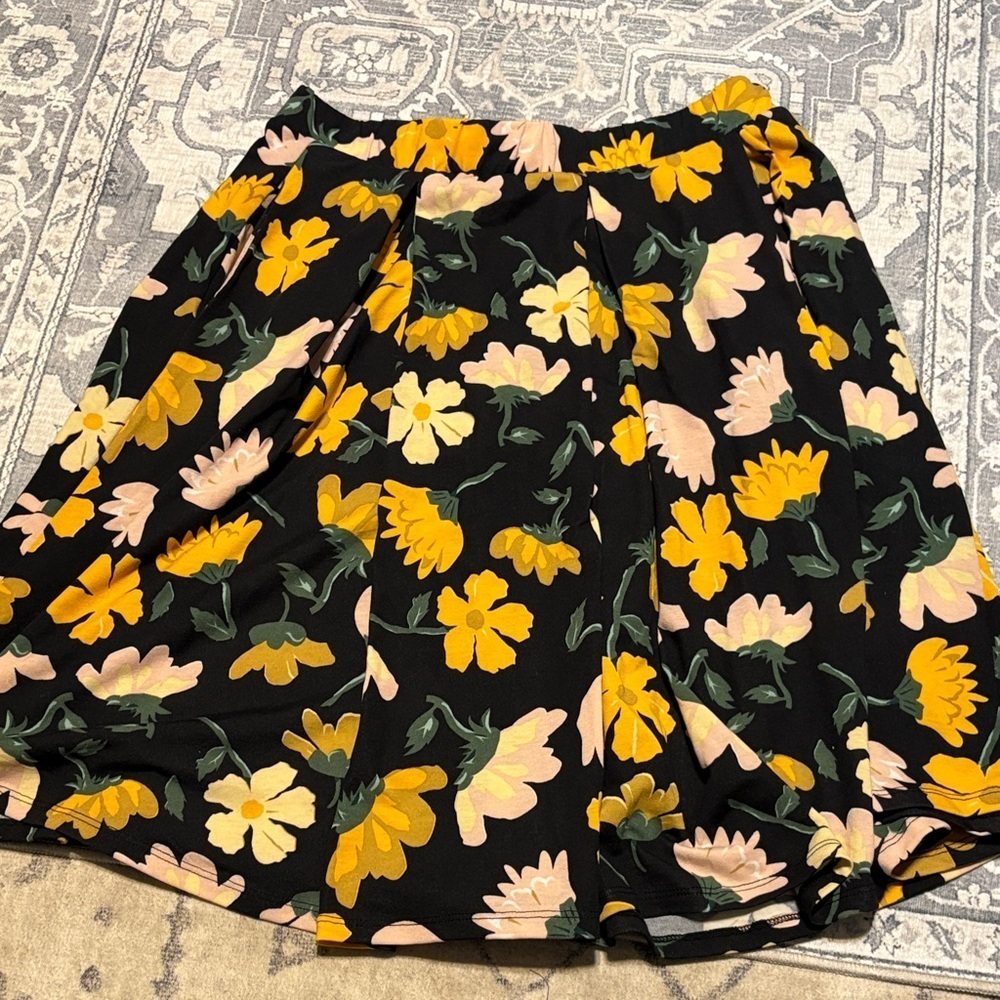 LuLaRoe Black Skirt with Yellow and Cream Floral. Size medium. Below the knee.